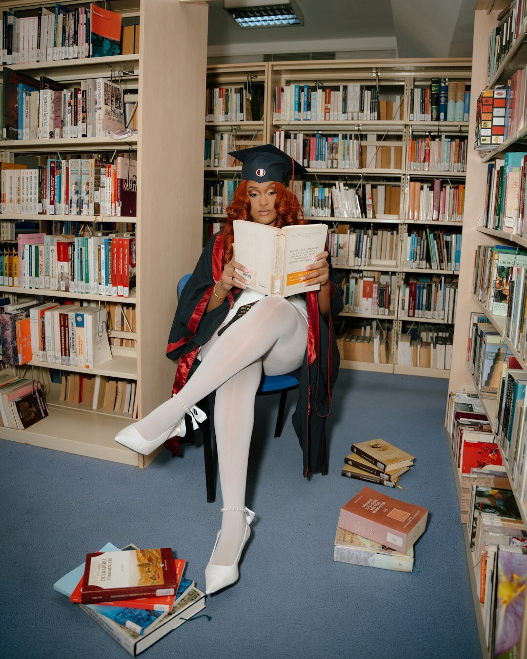 detective reading book in library