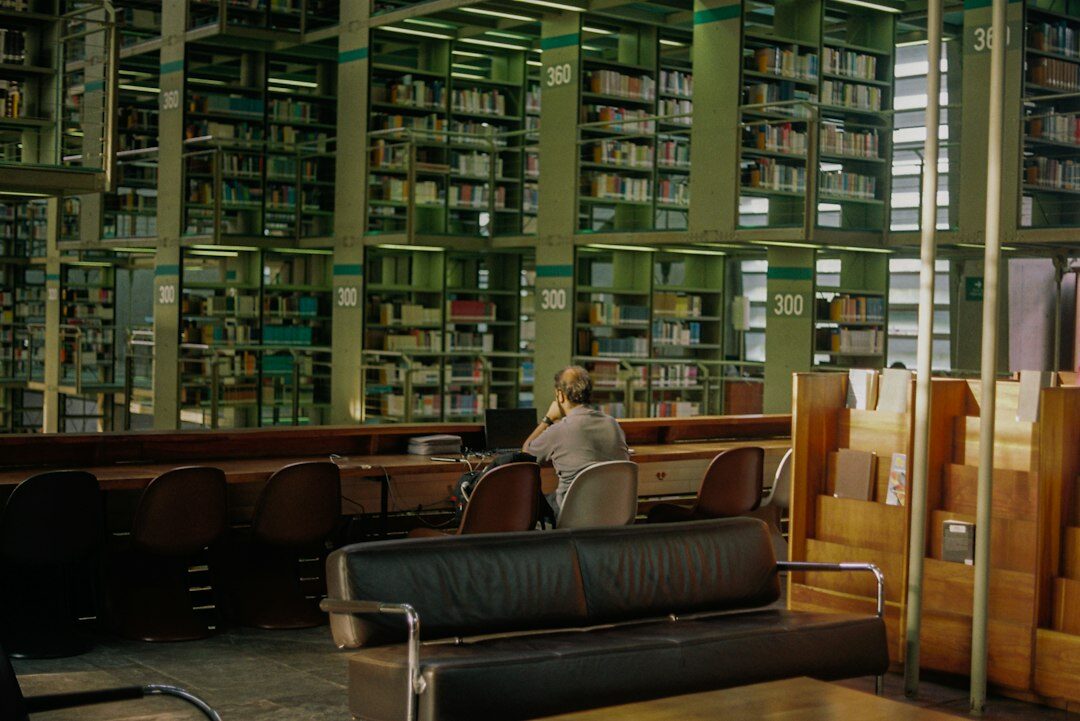 detective reading book in library